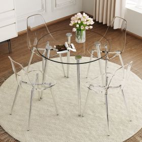 A modern minimalist style round transparent tempered glass table, silver metal legs, paired with 4 modern style transparent dining chairs